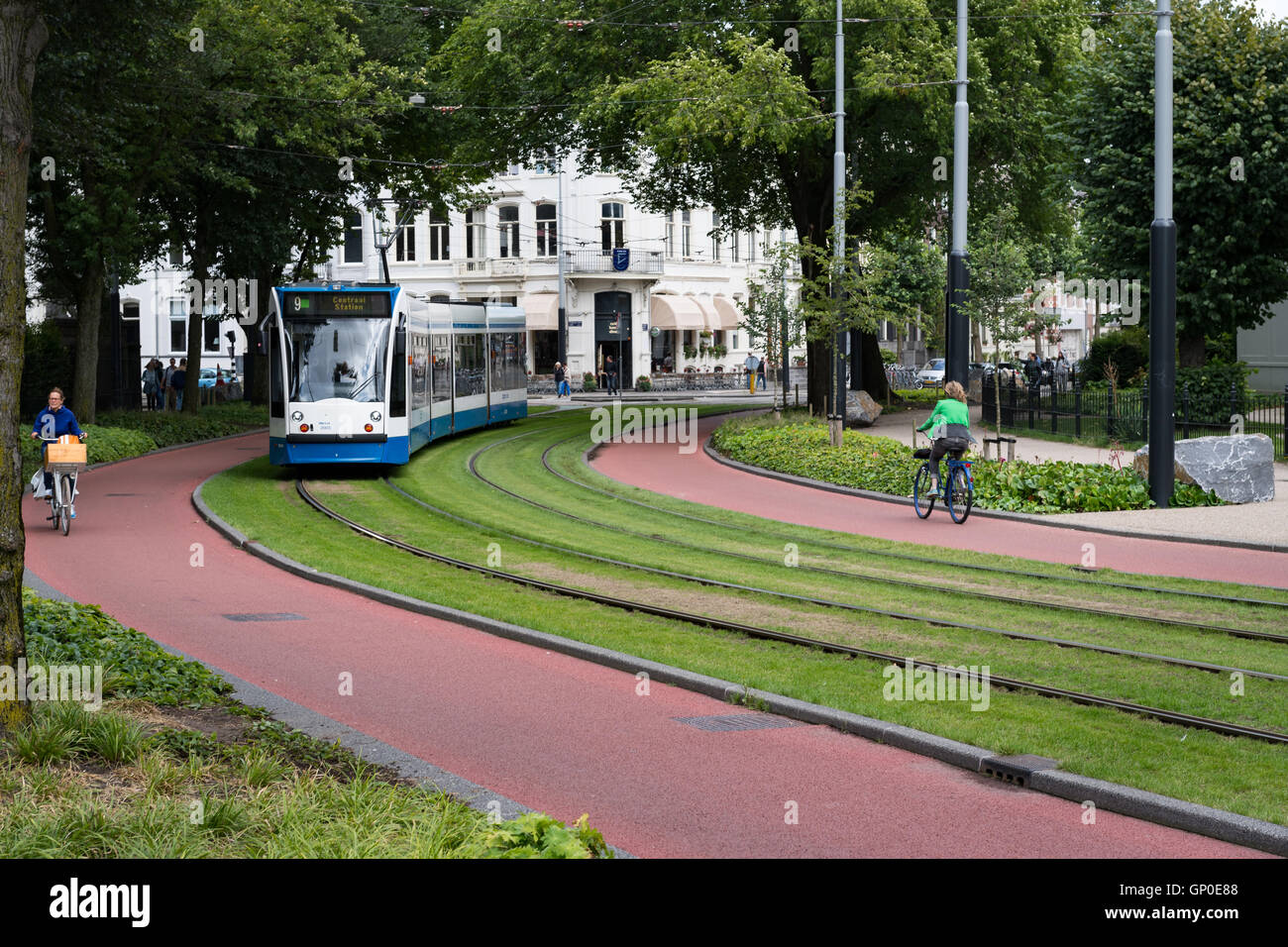 Trams and bike paths key transport in Amsterdam Stock Photo Alamy