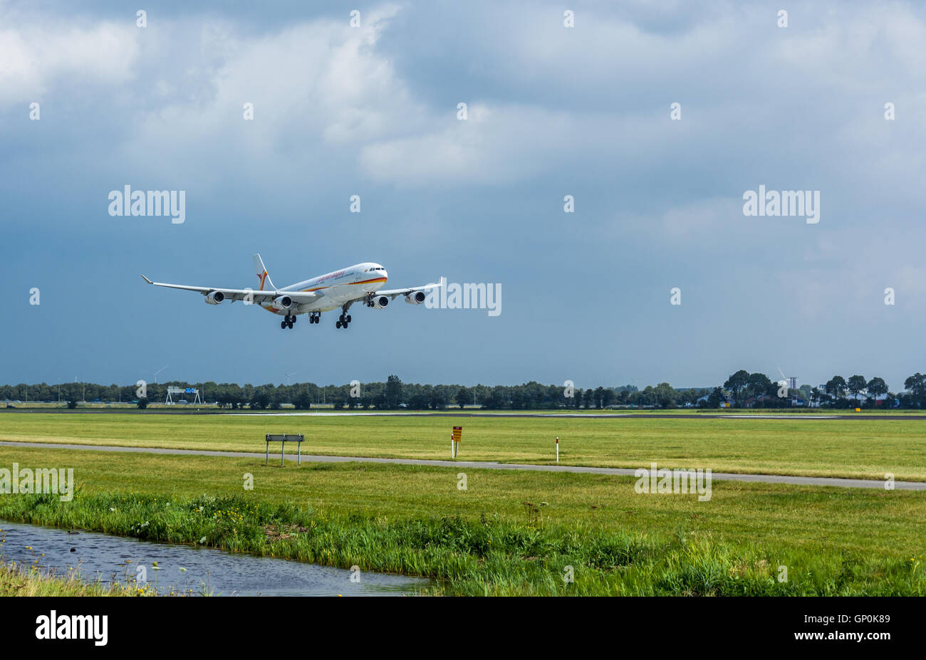 Schiphol Airport, the Netherlands - August 20, 2016: Surinam Airways Airbus A340-300 landing at Amsterdam Schiphol Airport Stock Photo