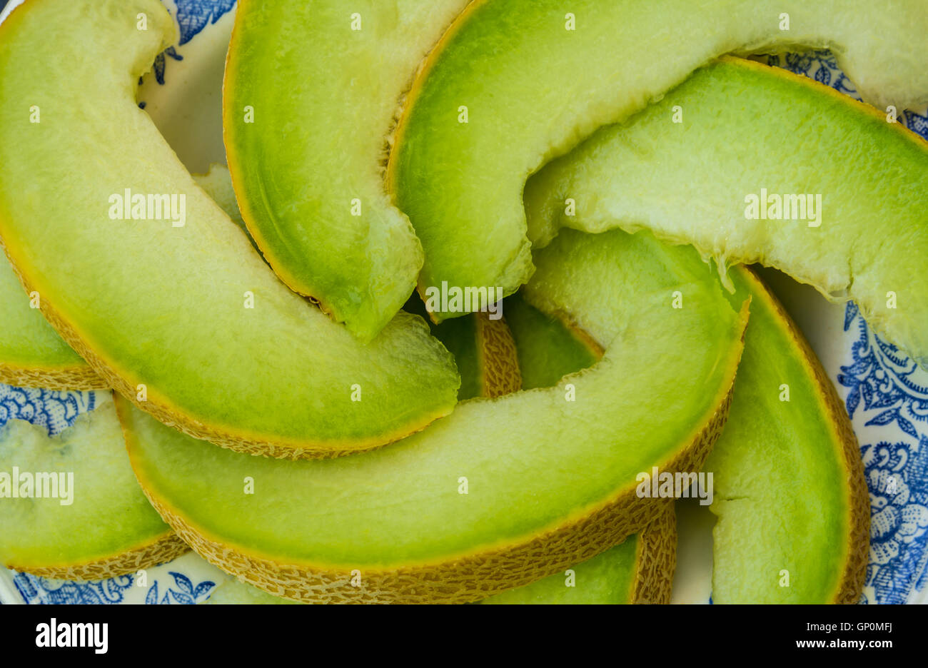 juicy ripe honeydew melon on a plate Stock Photo