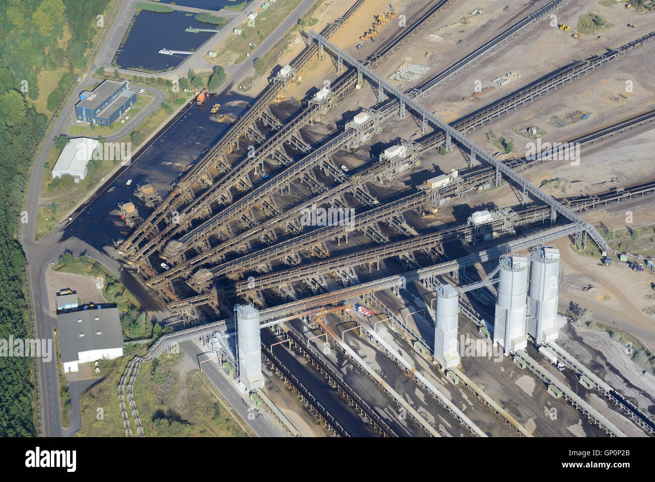 AERIAL VIEW. Junction of conveyor belts at the Garzweiler Coal Mine. Jüchen, North Rhine-Westphalia, Germany. Stock Photo