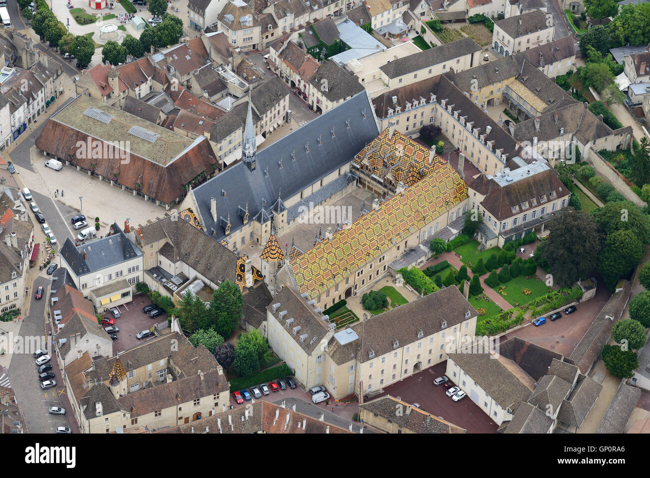 AERIAL VIEW. Medieval Hospice of Beaune with its roof of glazed tiles. Hotel-Dieu of Beaune, Cote d'Or, Burgundy, France. Stock Photo