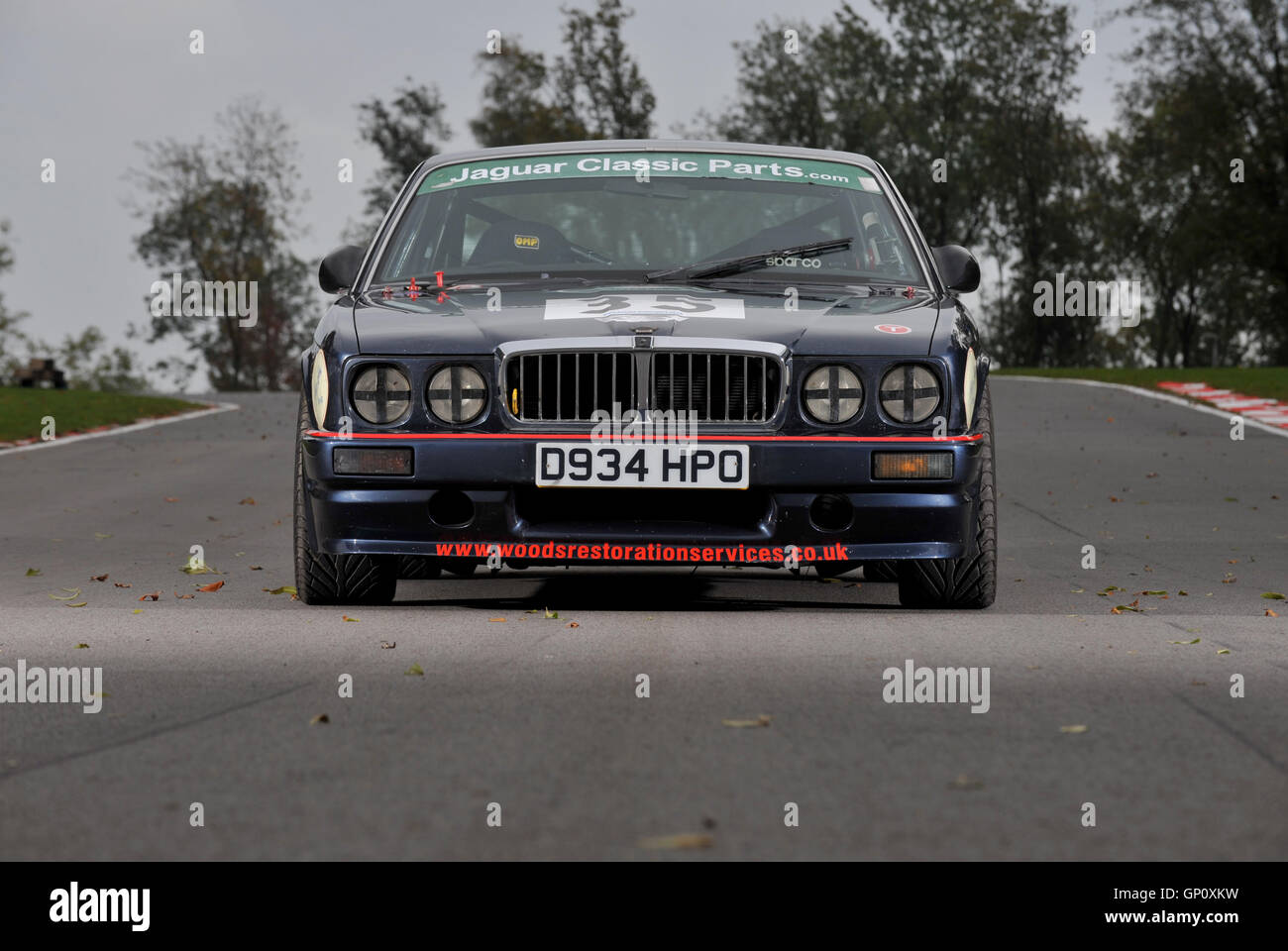 Road (1990) and race (1986) versions of the Jaguar XJ6 luxury saloon car Stock Photo