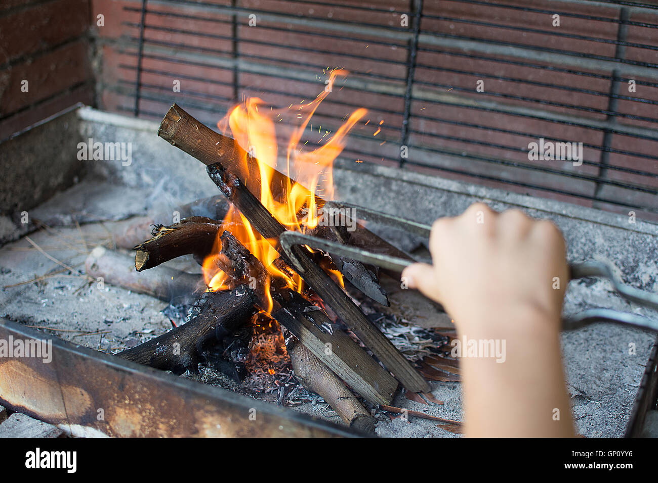 Starting Fire for Charcoal Grill. Arm With Long-Handled Tongs ...