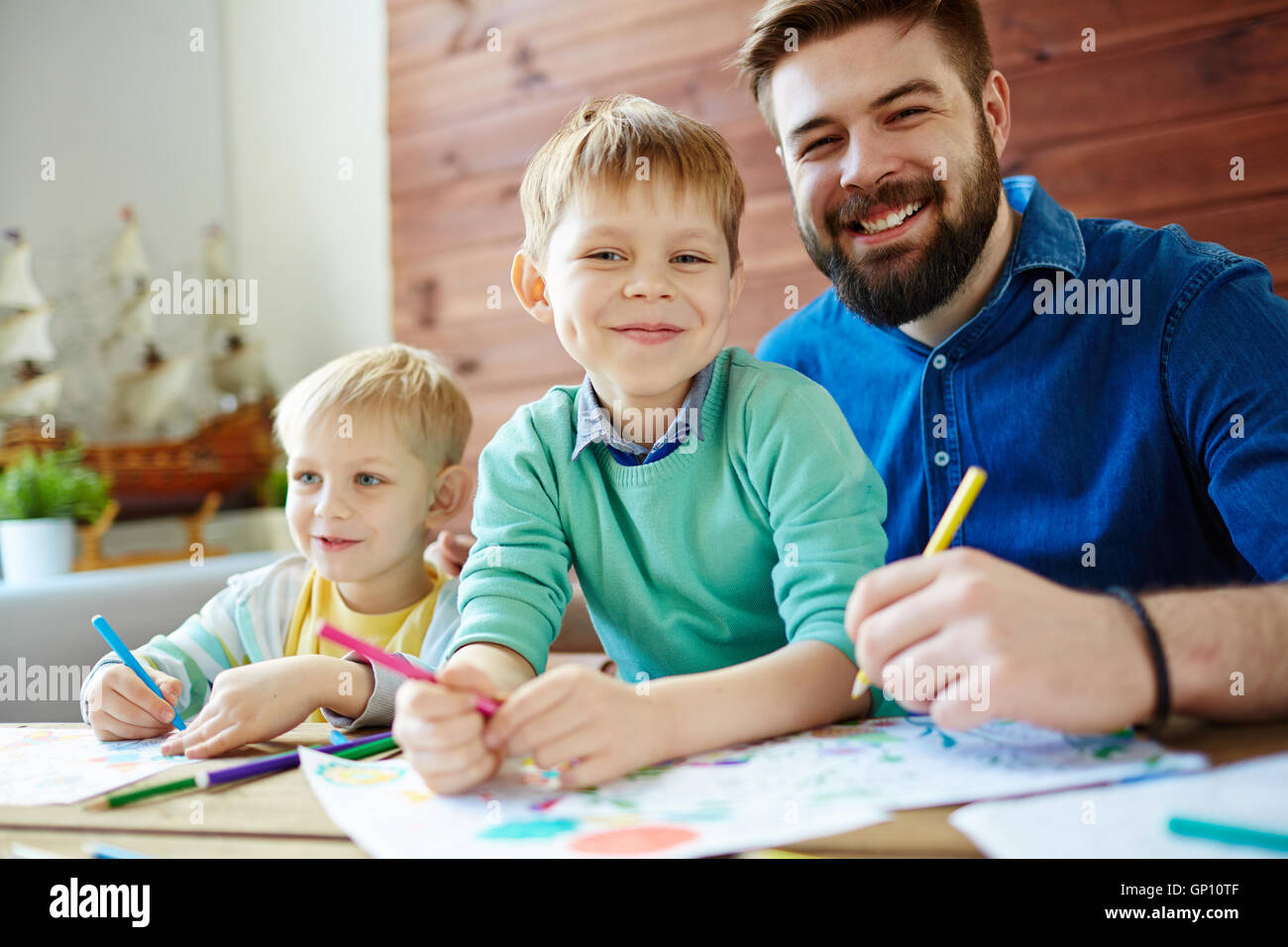 Son and father painting hi-res stock photography and images - Alamy