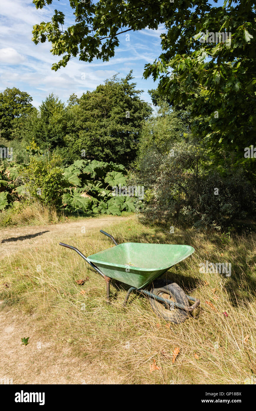 Wheel barrow at garden pond hires stock photography and images Alamy