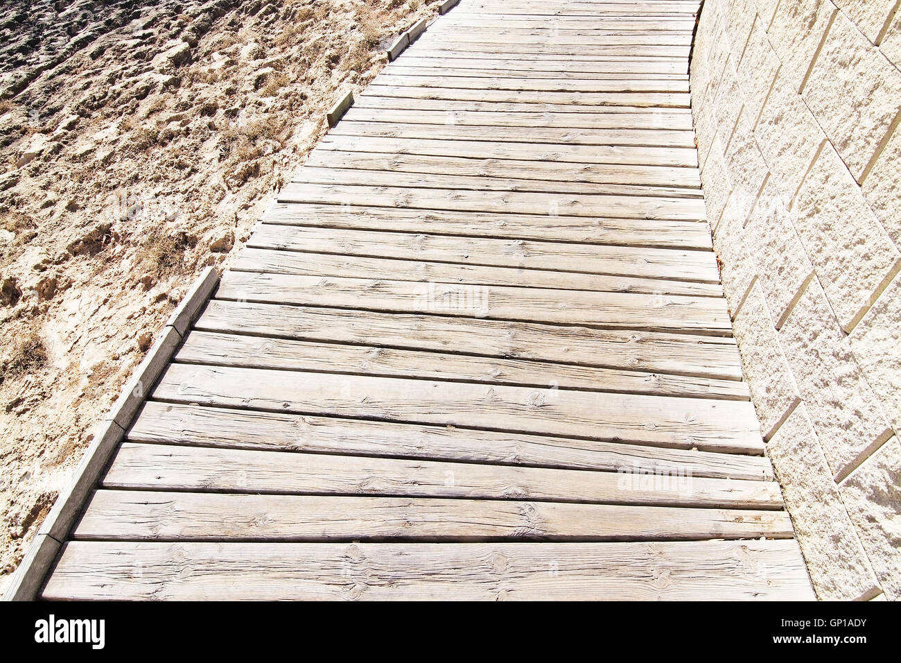 Curved wood planks boardwalk in Mallorca, Balearic islands, Spain Stock