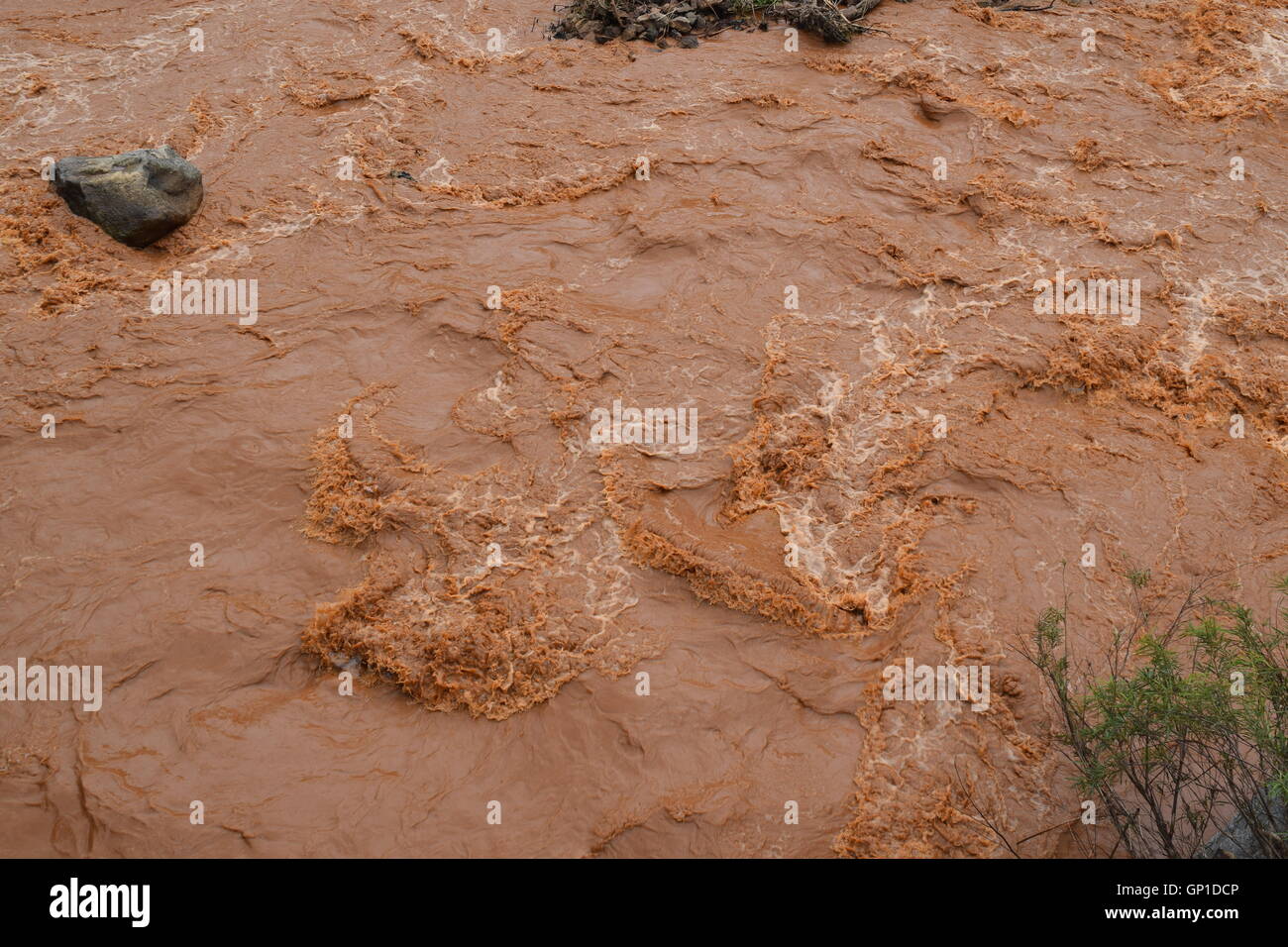 floody river with red alluvial strongly flowing in Dak Lak, vietnam Stock Photo
