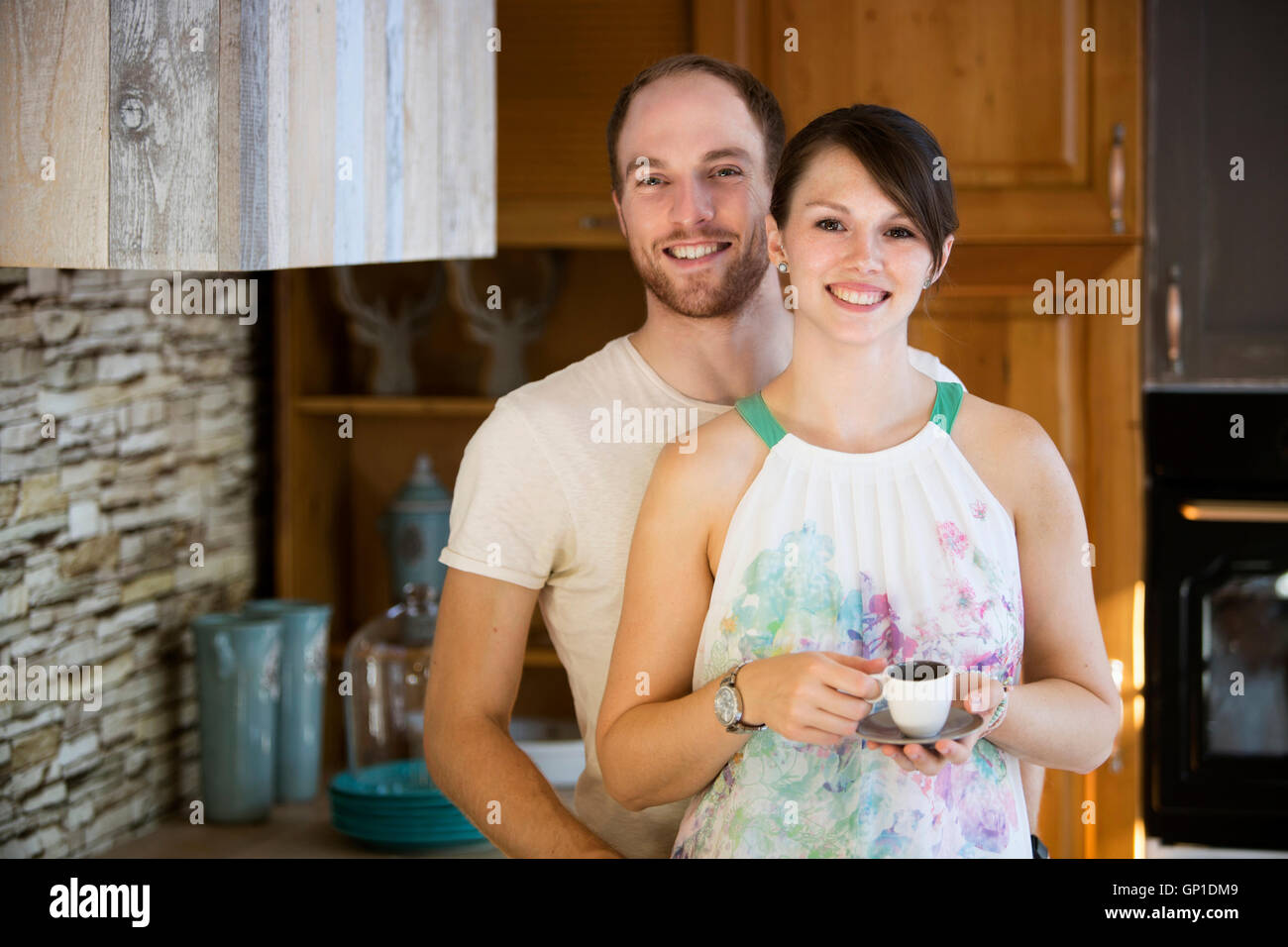 Couple standing in kitchen hi-res stock photography and images - Alamy