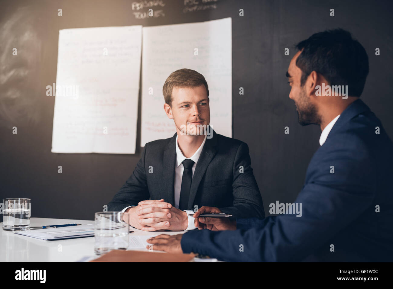 Talking business in the boardroom Stock Photo