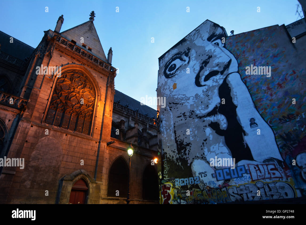 France, Paris, Chut or Shhh or Chuuuttt! stencil graffiti by Jef Aerosol at Place Igor Stravinsky with Saint-Merri church Stock Photo