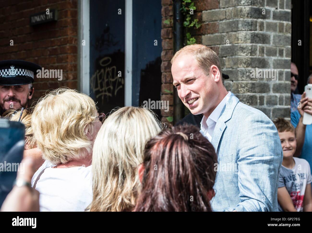 The Duke of Cambridge before he is hugged by Linda Moore (left) as he meets the public as he visits Truro Cathedral at the start of a day-long tour of Cornwall. Stock Photo