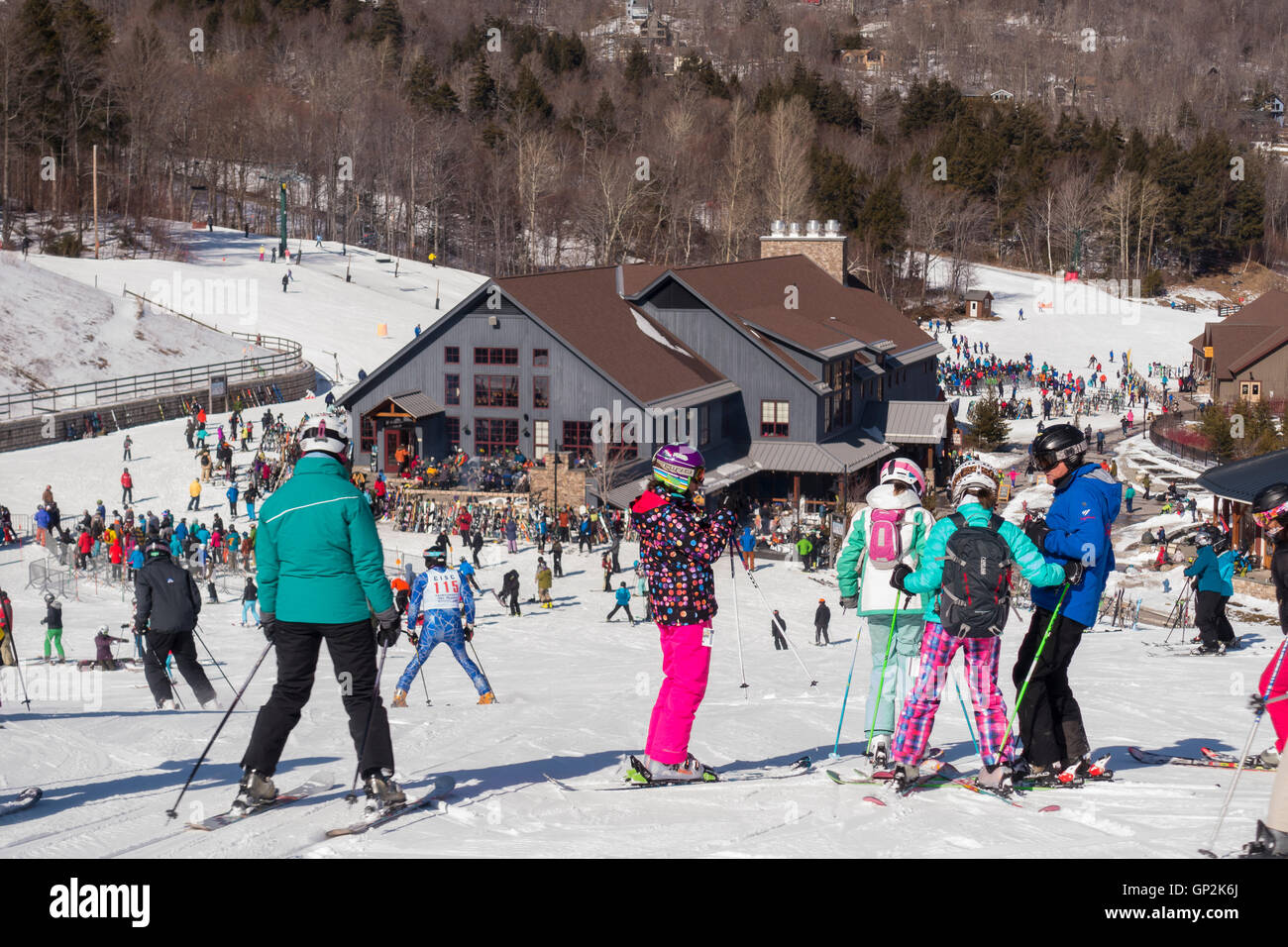 WARREN, VERMONT, USA - Crowd of skiers and lodge, Sugarbush Ski Area. Stock Photo