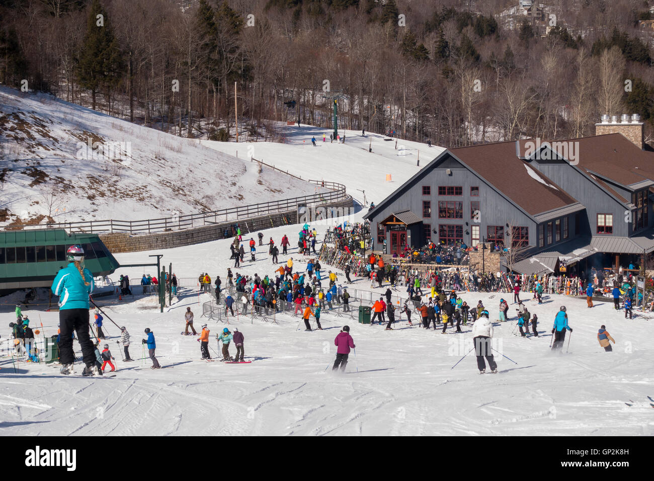 WARREN, VERMONT, USA Crowd of skiers and lodge, Sugarbush Ski Area
