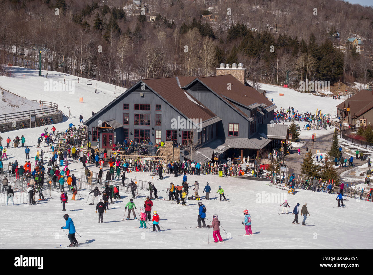 WARREN, VERMONT, USA - Crowd of skiers and lodge, Sugarbush Ski Area. Stock Photo