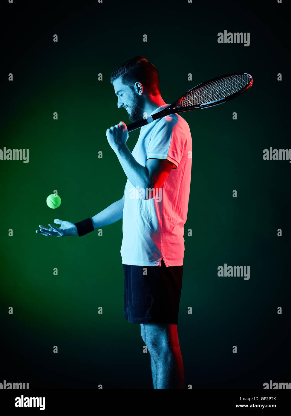 one caucasian tennis player man studio isolated on black background Stock Photo