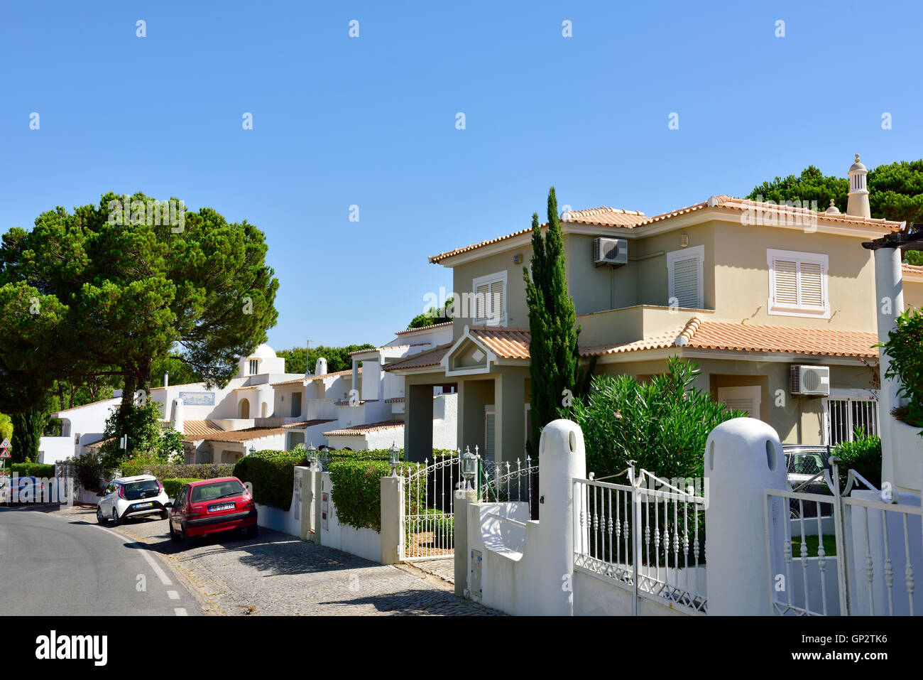 Houses along residential street in Vilamoura, Algarve, south Portugal Stock Photo