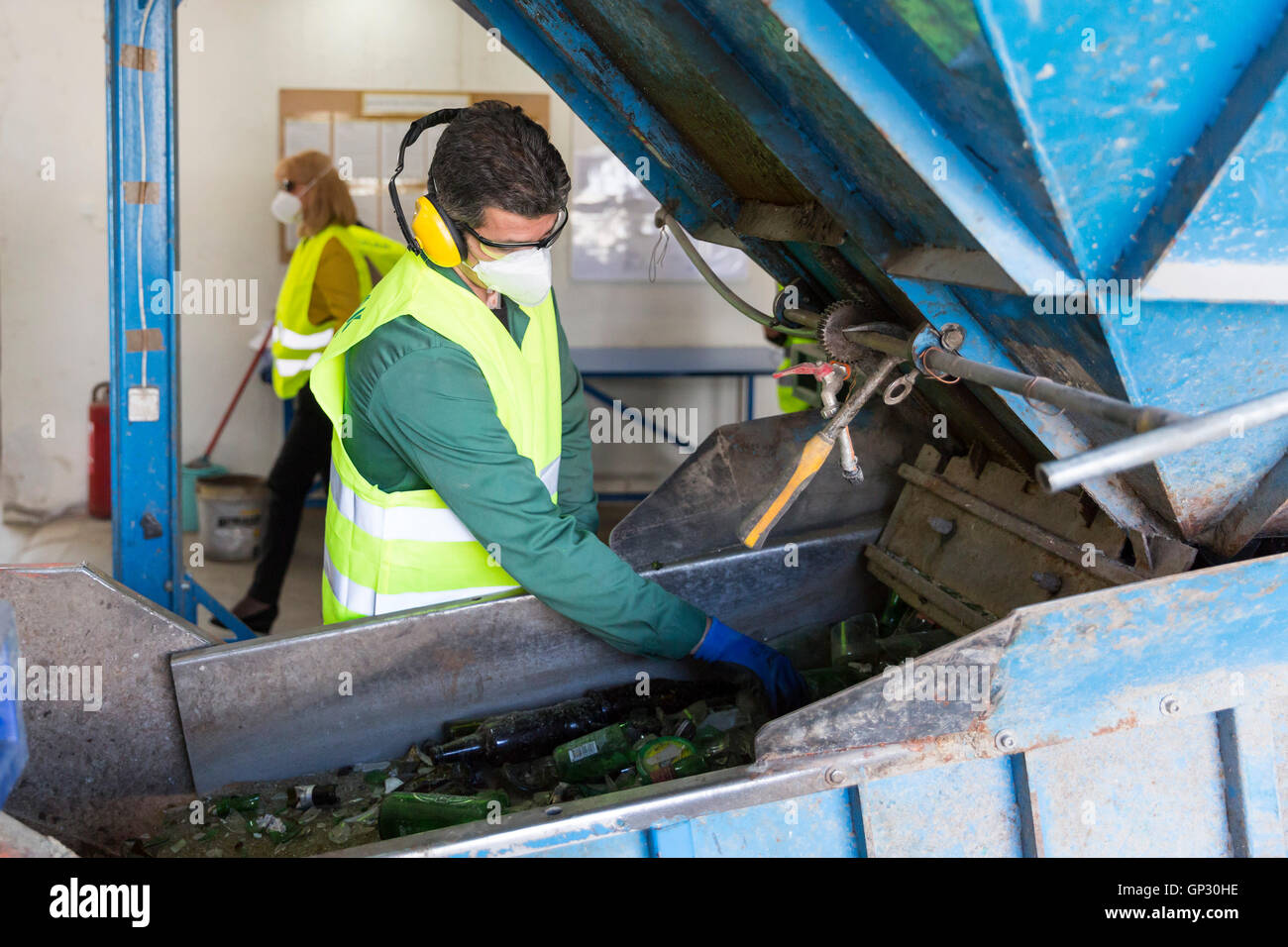 Sofia, Bulgaria May 26, 2016 Glass waste worker is recycling glass