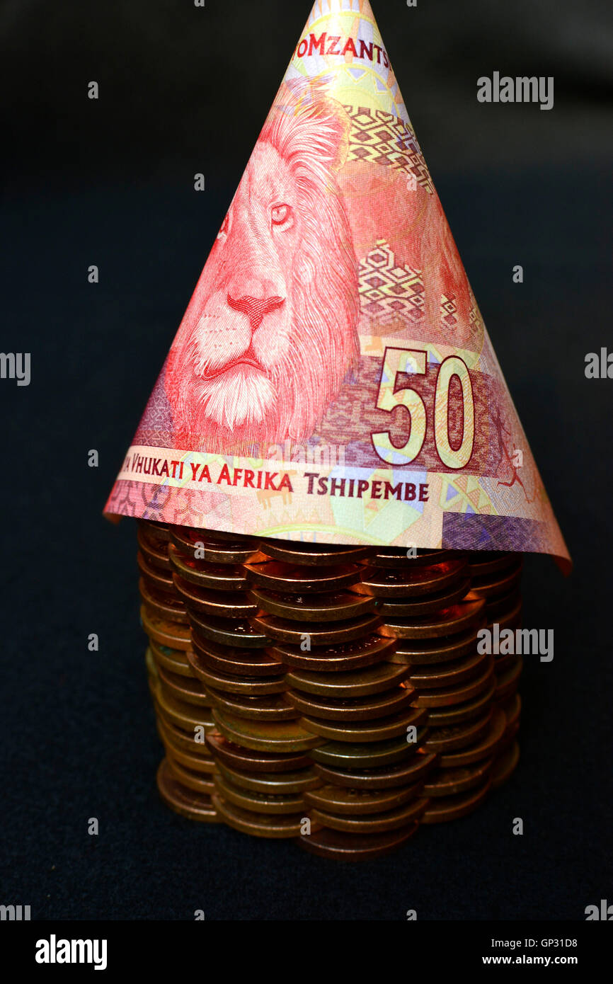 Investing in Africa concept. Money shaped in the form of an African hut. Stock Photo