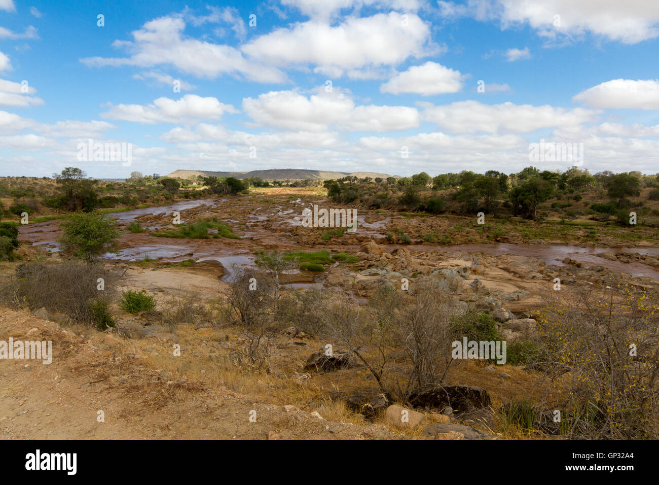 African Landscape of open savanna and river on sunny day, Tsavo National Park, Kenya Stock Photo