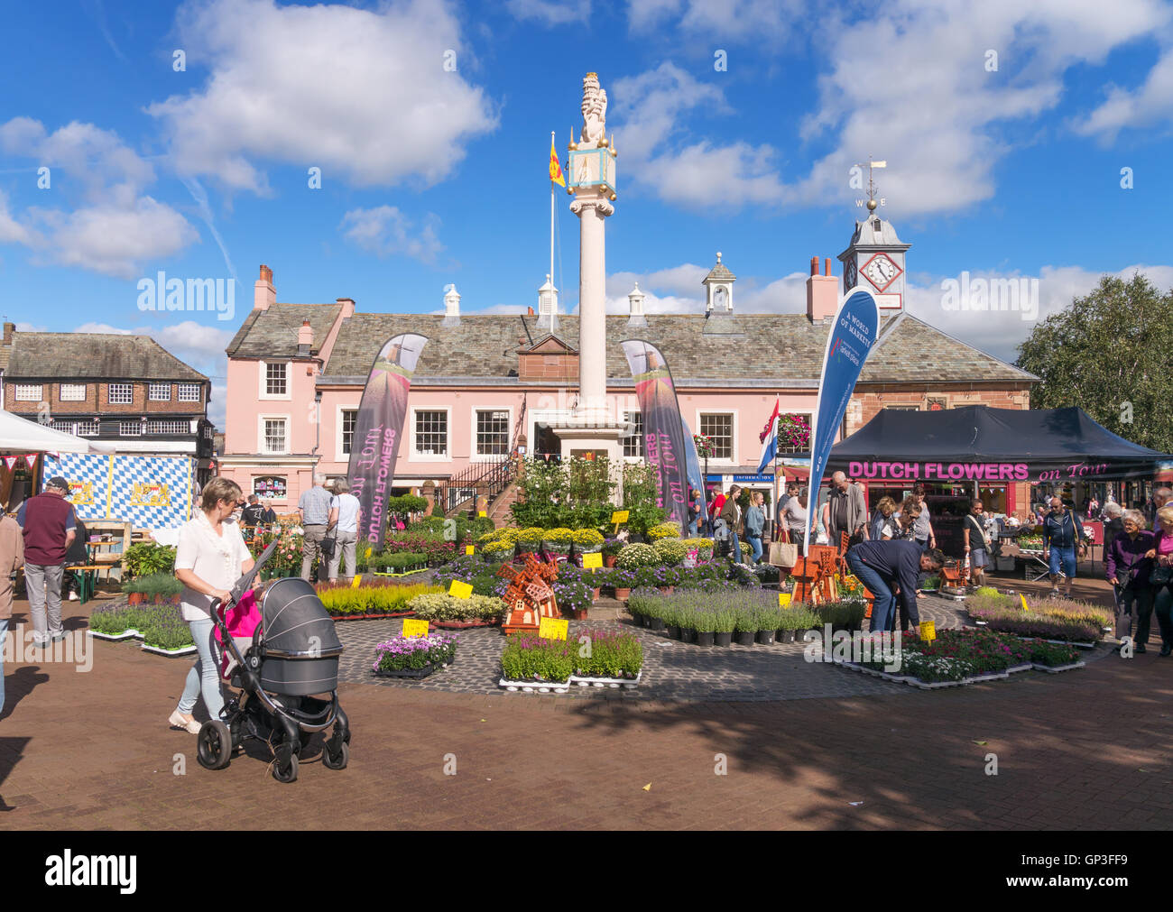 People visiting Carlisle market cross and square, Cumbria, England, UK