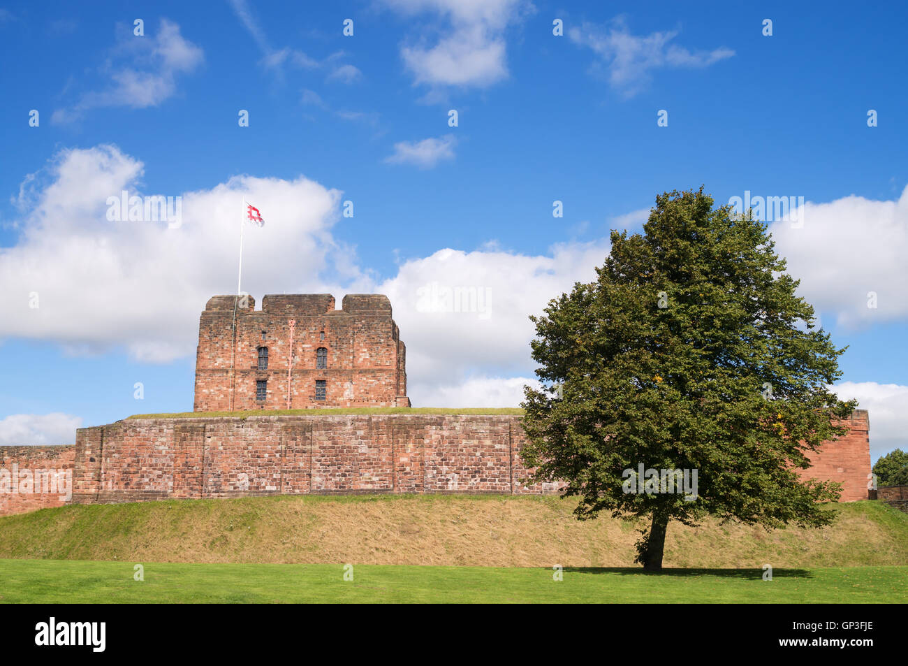 Carlisle castle keep and outer wall, with English Heritage flag flying, Cumbria, England, UK Stock Photo