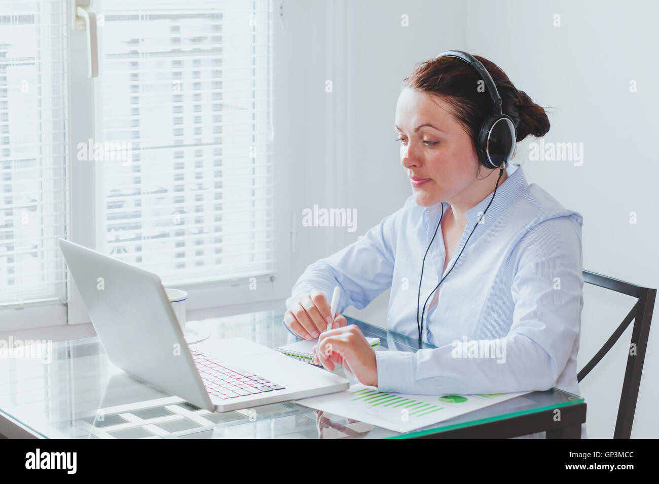 business woman participating online video conference in the office Stock Photo