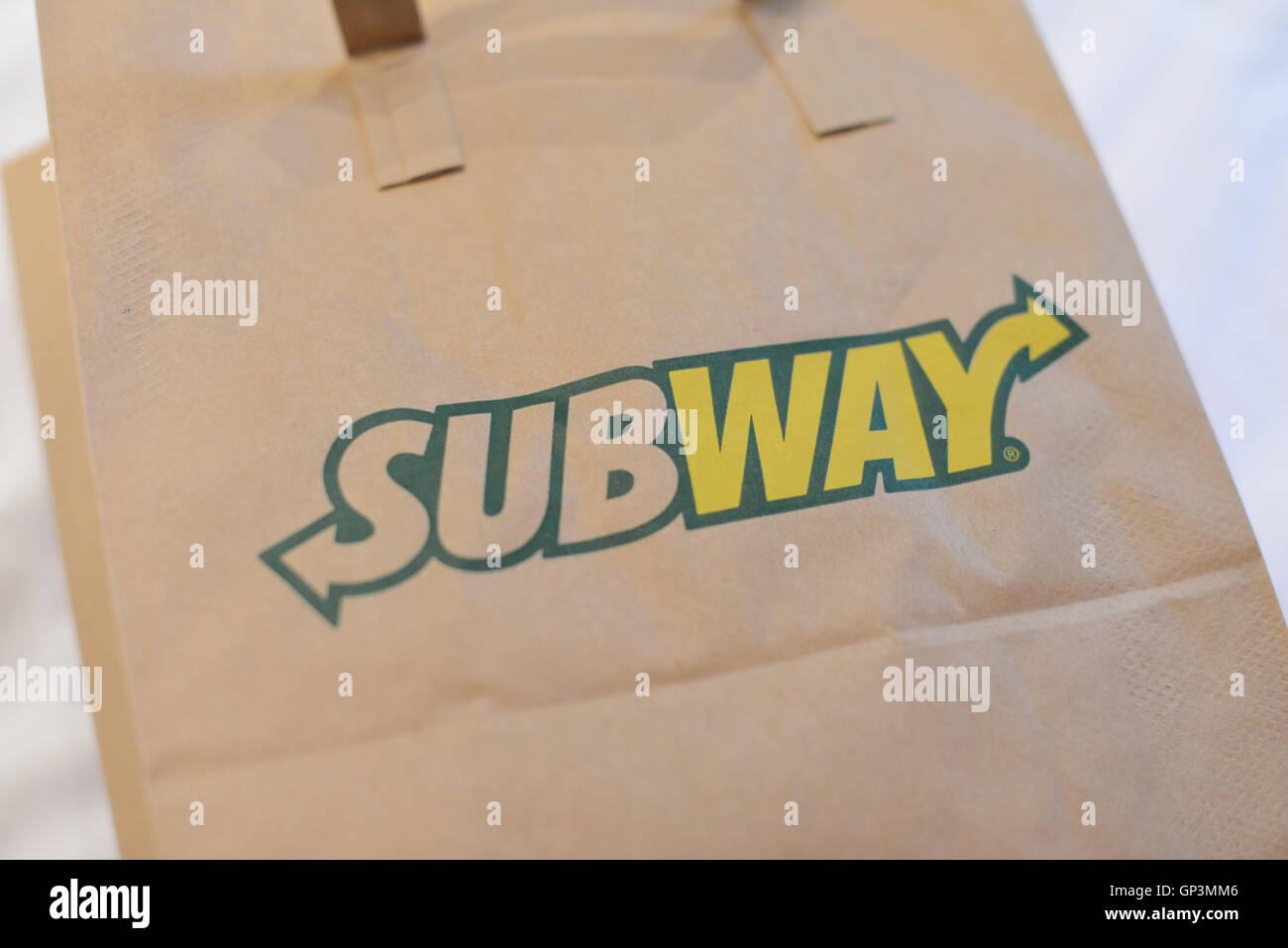 Brown paper subway bag showing the subway logo Stock Photo