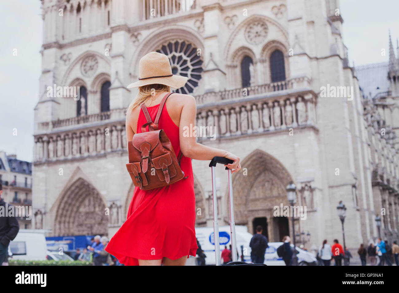 travel in Europe, gothic architecture of catholic church, tourist looking at Notre Dame cathedral in Paris, France Stock Photo