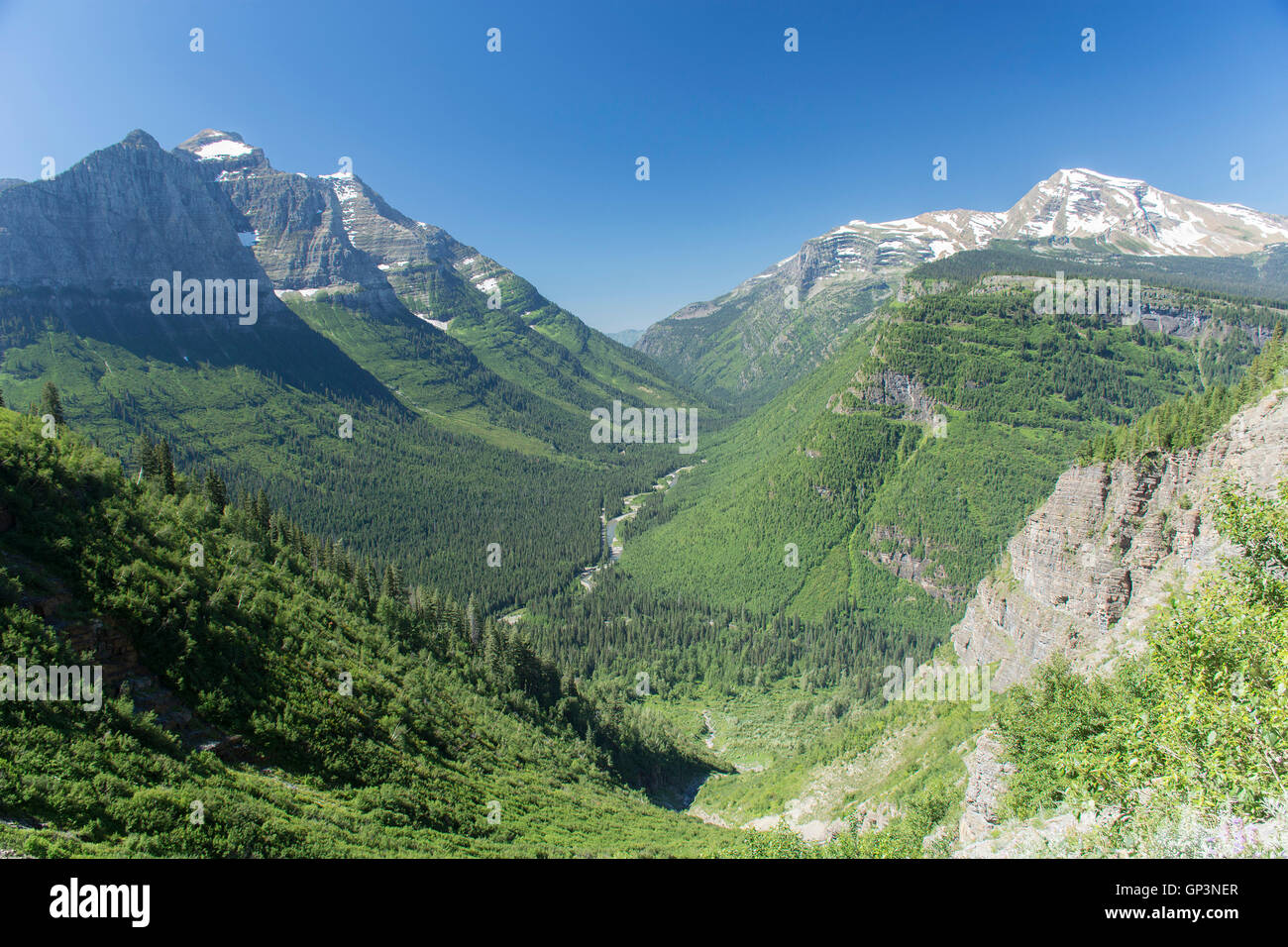 An overlook showing a mountain valley on Going-to-the-sun road in Glacier National Park, Montana, United States. Stock Photo