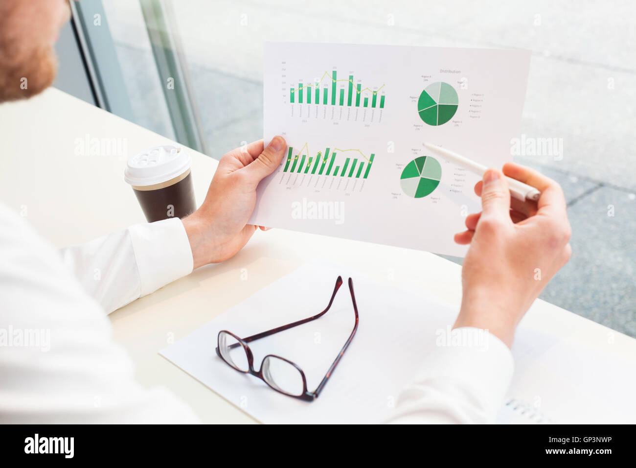 businessman analizing financial report, close up of hands Stock Photo