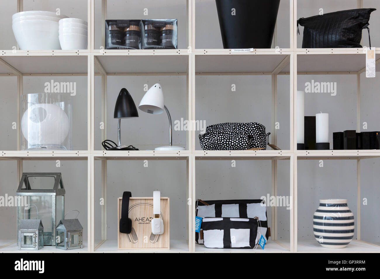 Monochrome shelf display of black and white gifts souvenirs lamps vases