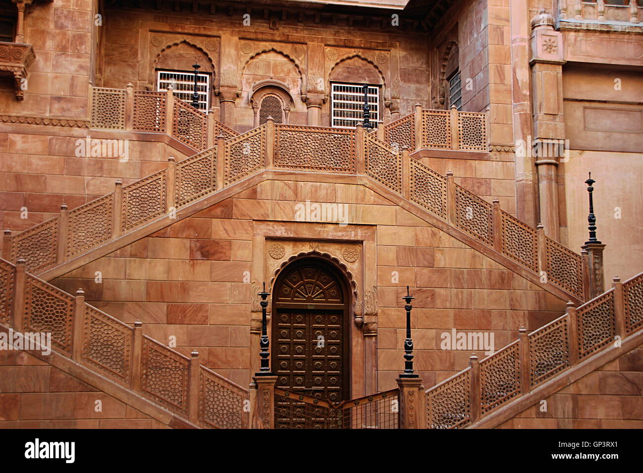 Red stone structure with twin staircases and embedded doors and windows at Junagarh fort, Bikaner, Rajasthan, India, Asia Stock Photo