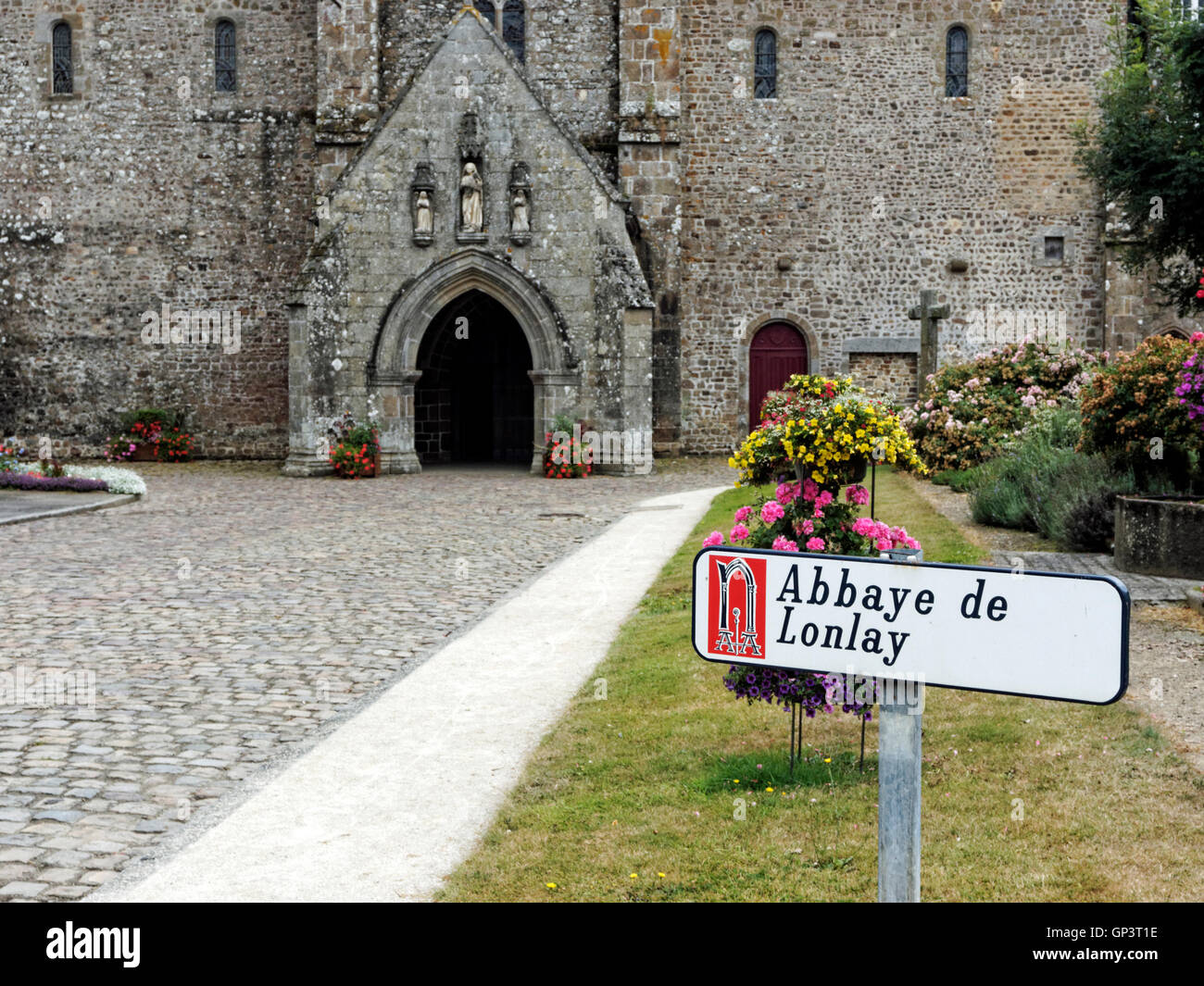 Approach and entrance to Abbaye de Lonlay a spectacular medieval church