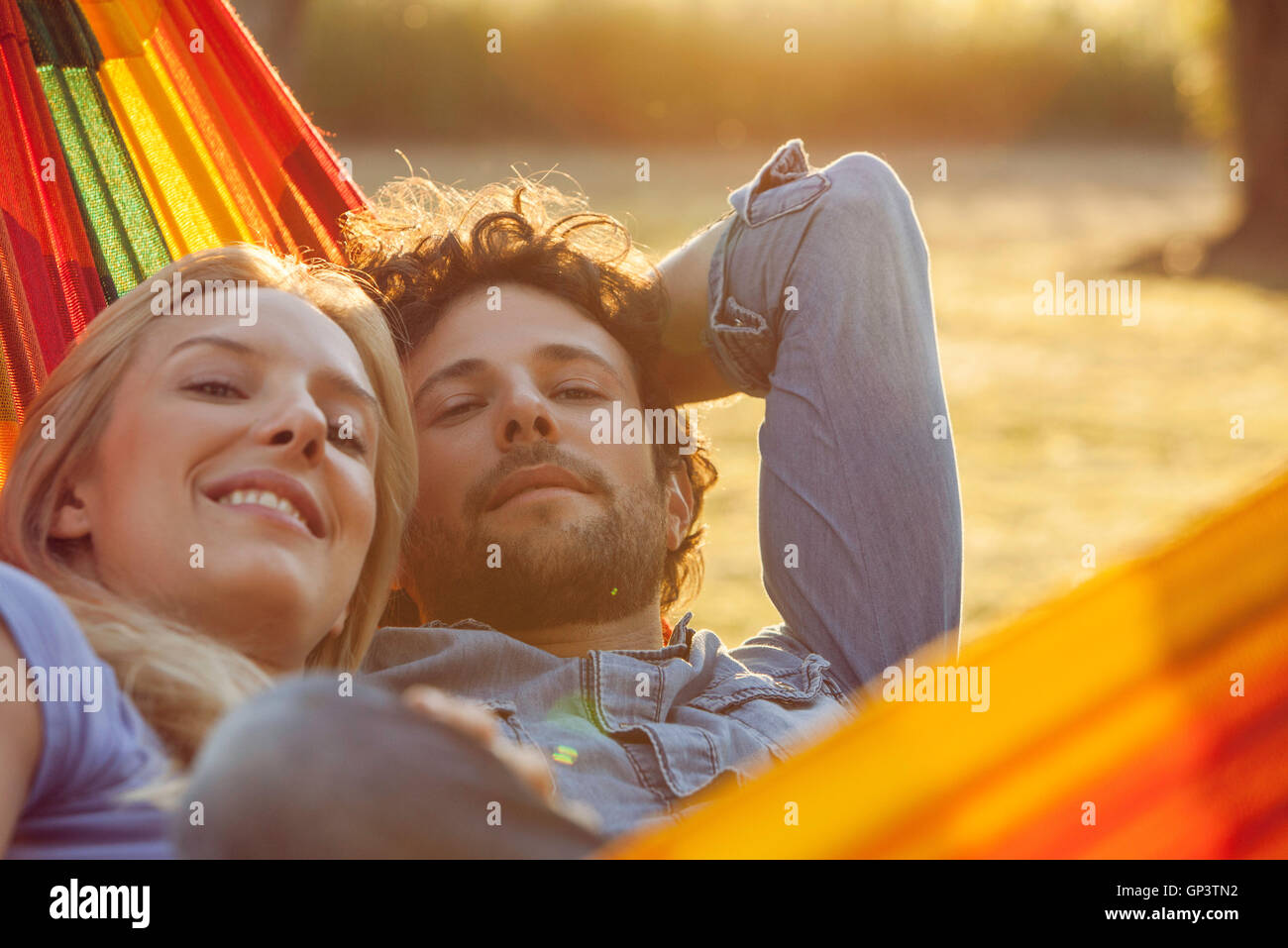 Couple relaxing together in hammock, portrait Stock Photo