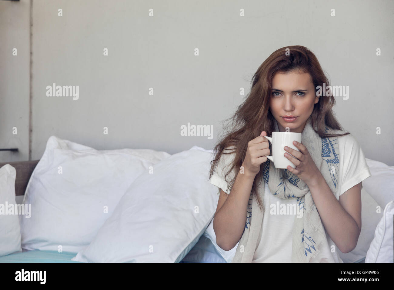 Woman enjoying cup of coffee Stock Photo