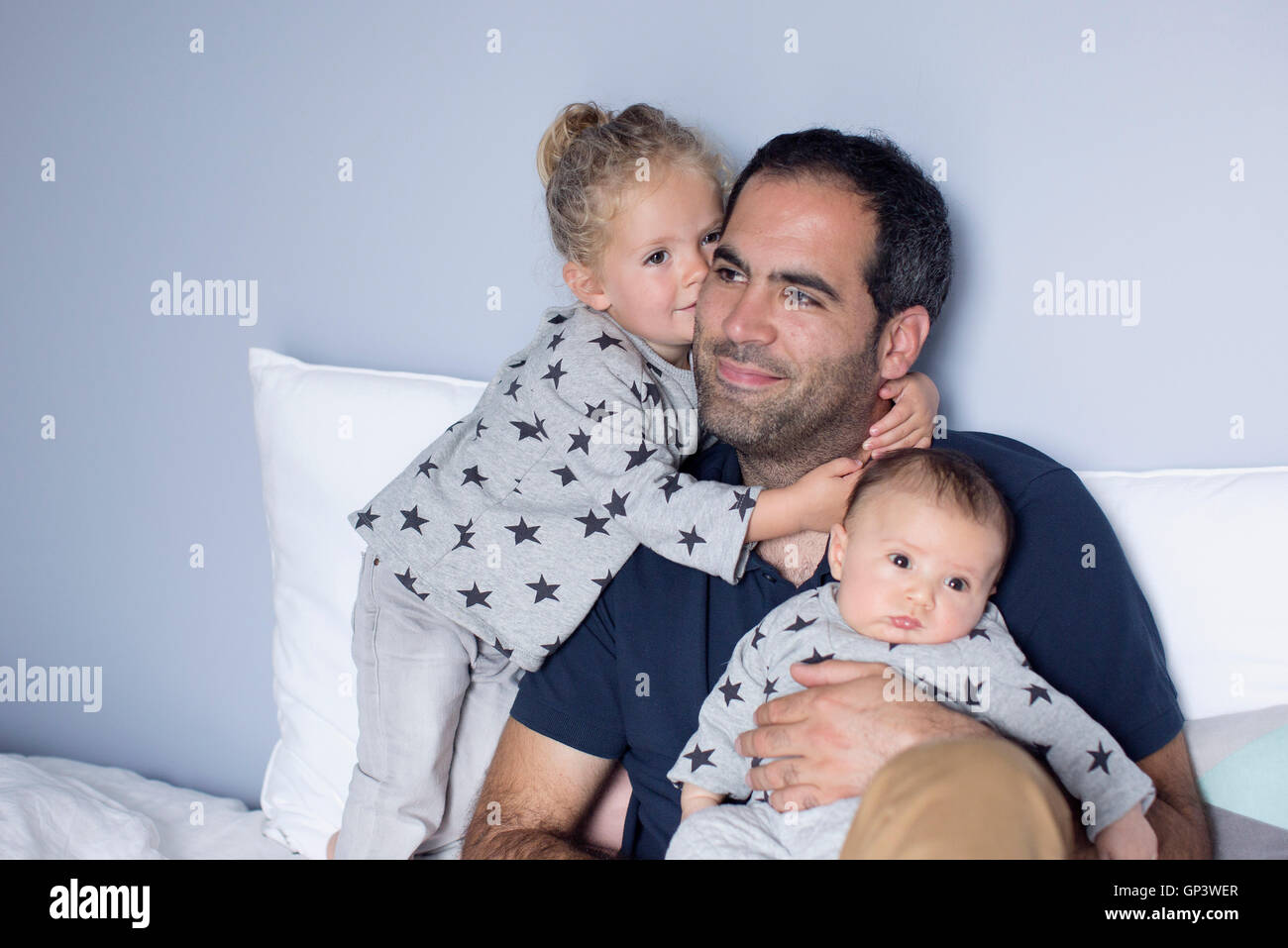 Father with baby boy and young daughter Stock Photo