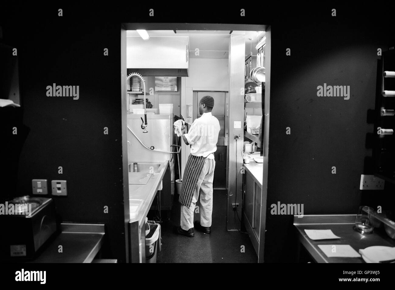 Restaurant dishwasher at work Stock Photo