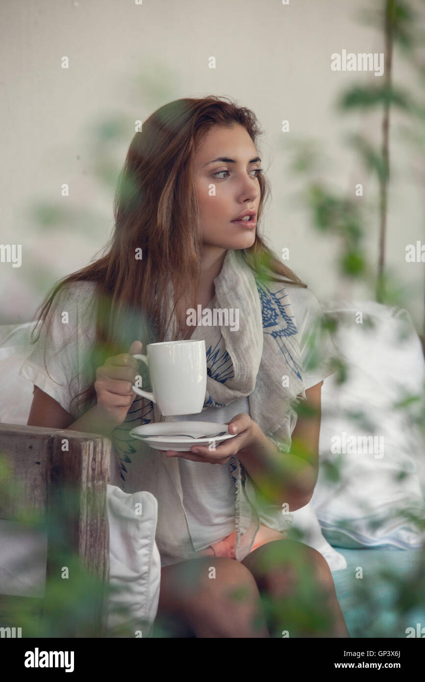 Woman enjoying hot drink outdoors Stock Photo