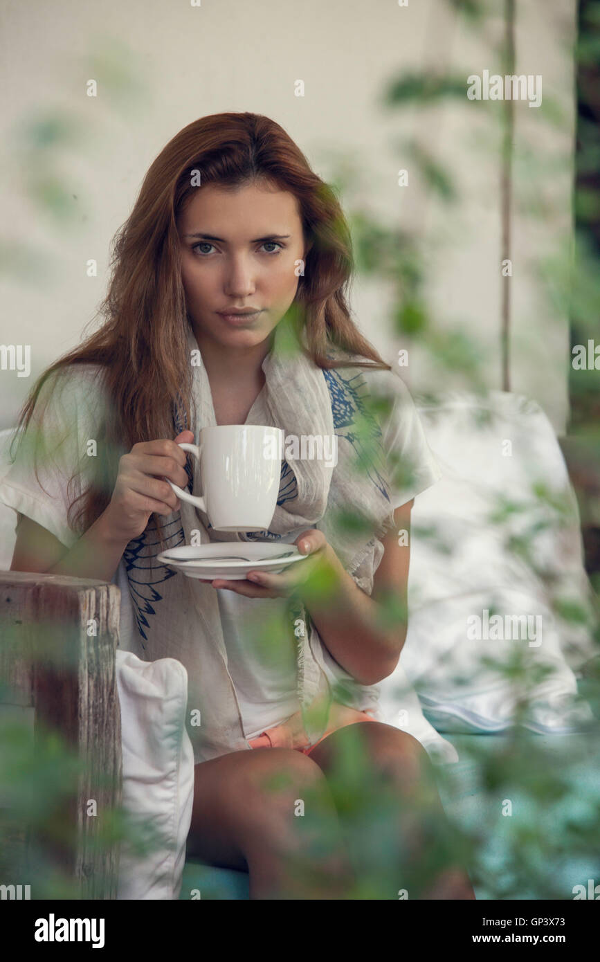Woman enjoying hot drink outdoors Stock Photo