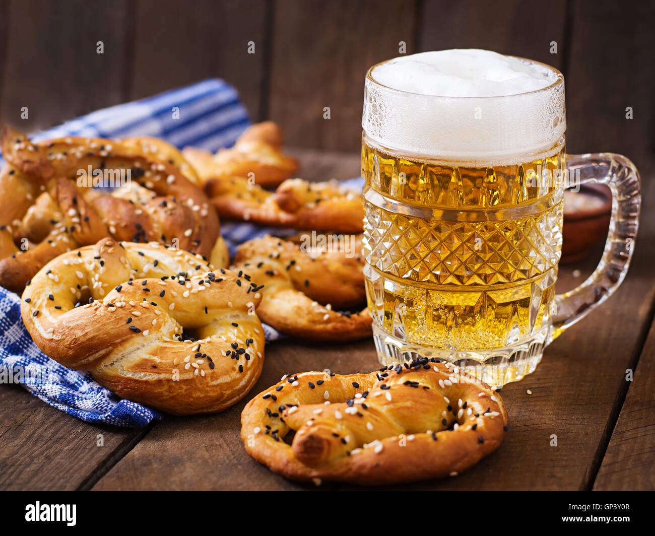 Oktoberfest salted soft pretzels in a bowl and beer from Germany on ...