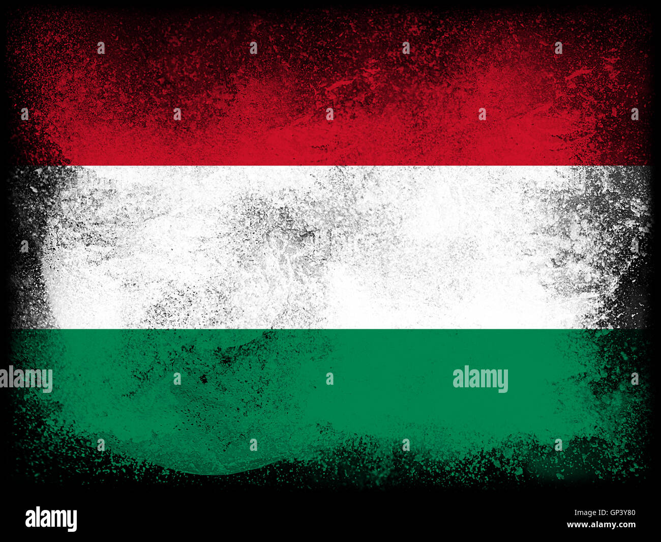Powder paint exploding in colors of Hungary flag isolated on black background. Abstract particles explosion of colorful dust. Stock Photo