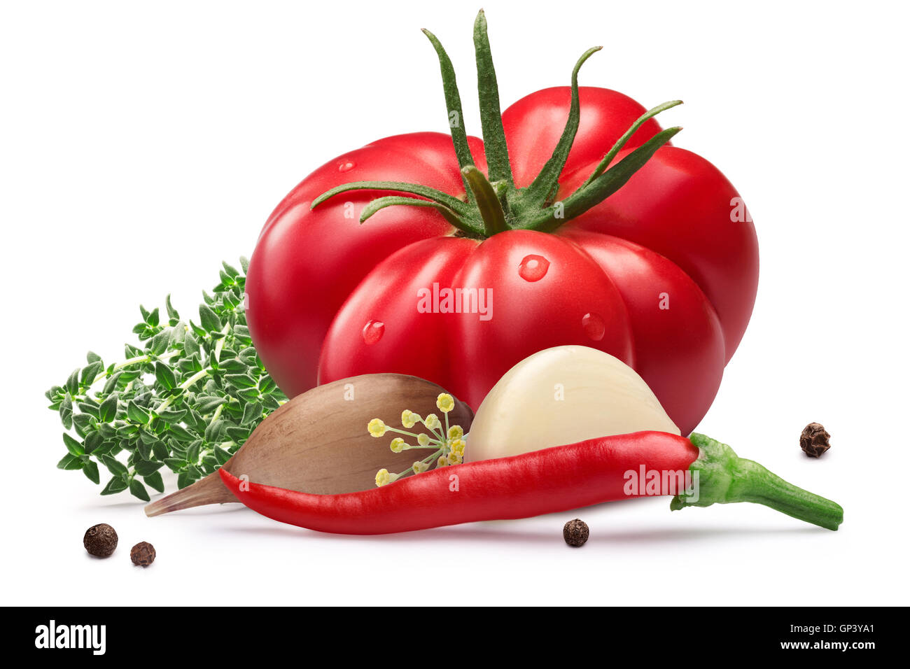 Fresh ribbed heirloom tomato for pickling with herbs, chili peppers and garlic. Clipping path, shadow separated. Design elements Stock Photo