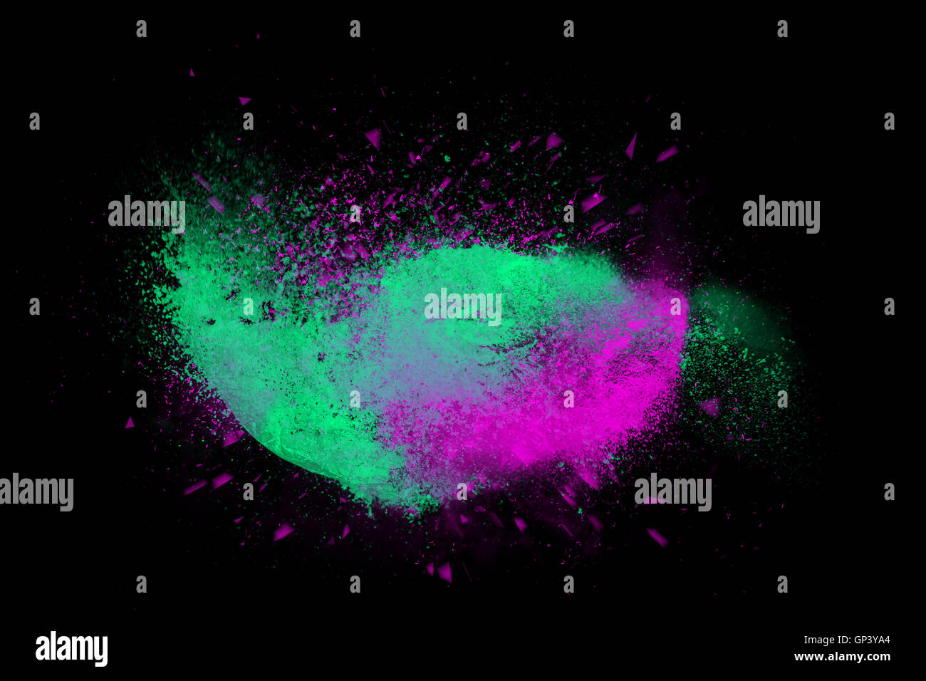 Freeze motion of colorful powder paint exploding isolated on black dark background. Abstract design of color dust cloud. Particl Stock Photo