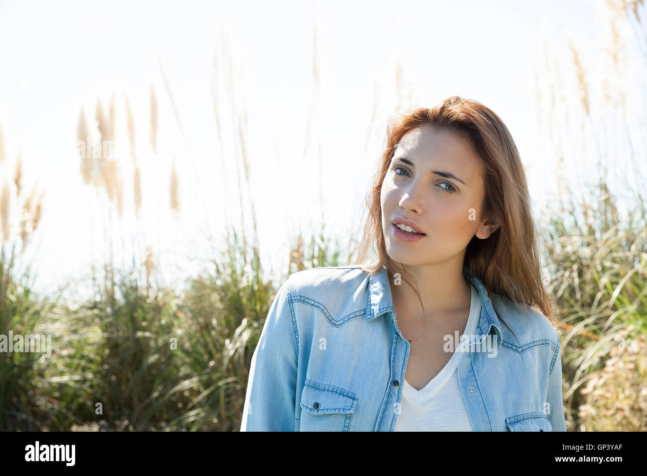 Young woman outdoors in nature, portrait Stock Photo