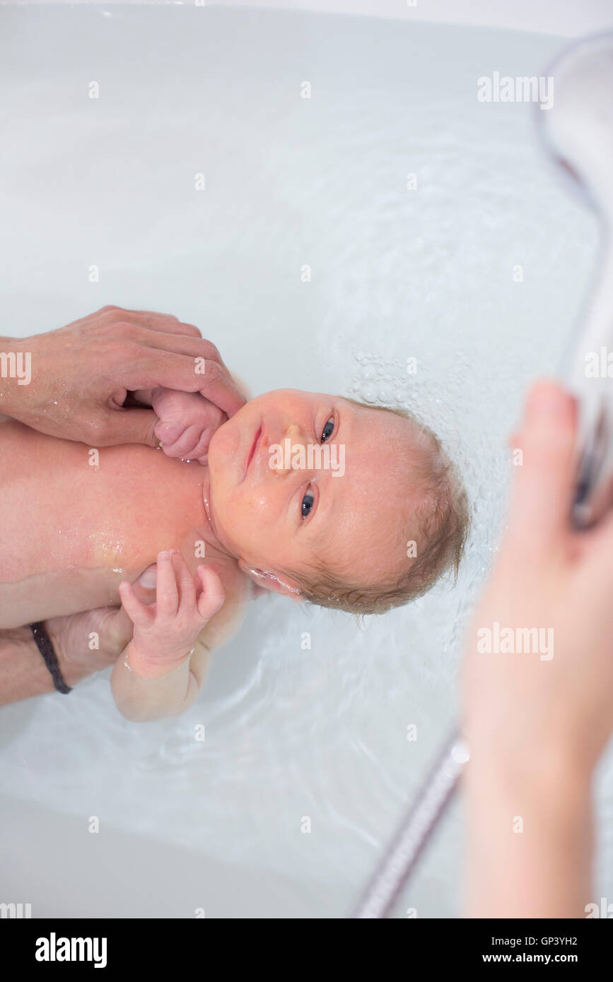 Newborn baby having bath Stock Photo Alamy