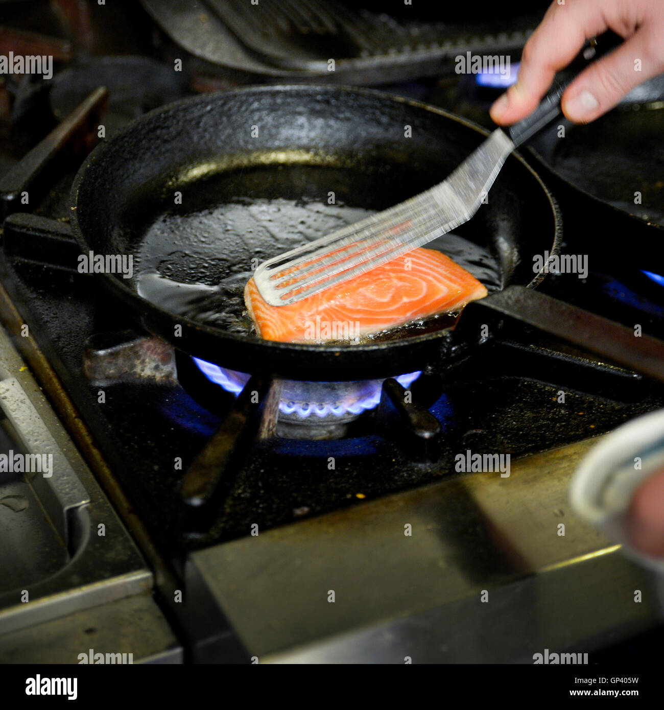 Searing salmon steak Stock Photo