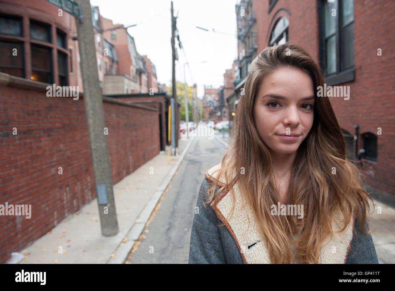 Teenage girl standing in alley, portrait Stock Photo