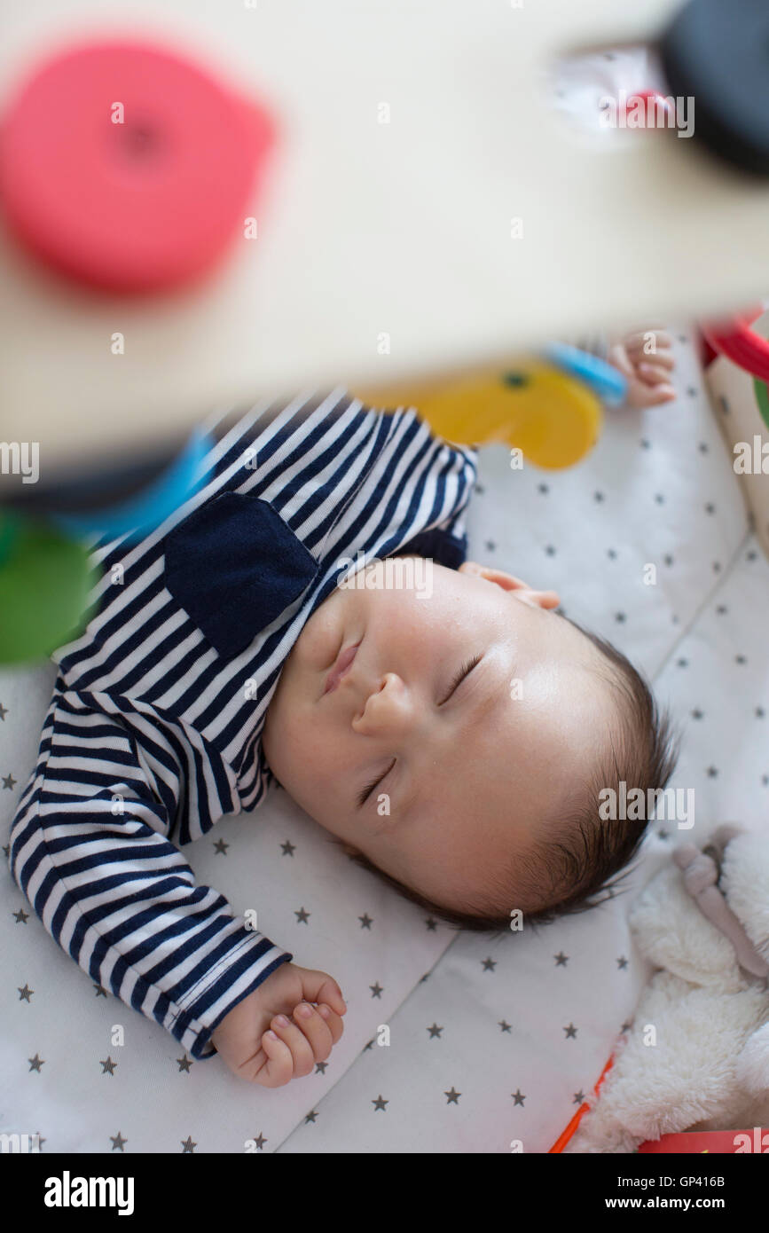Baby sleeping in crib Stock Photo Alamy