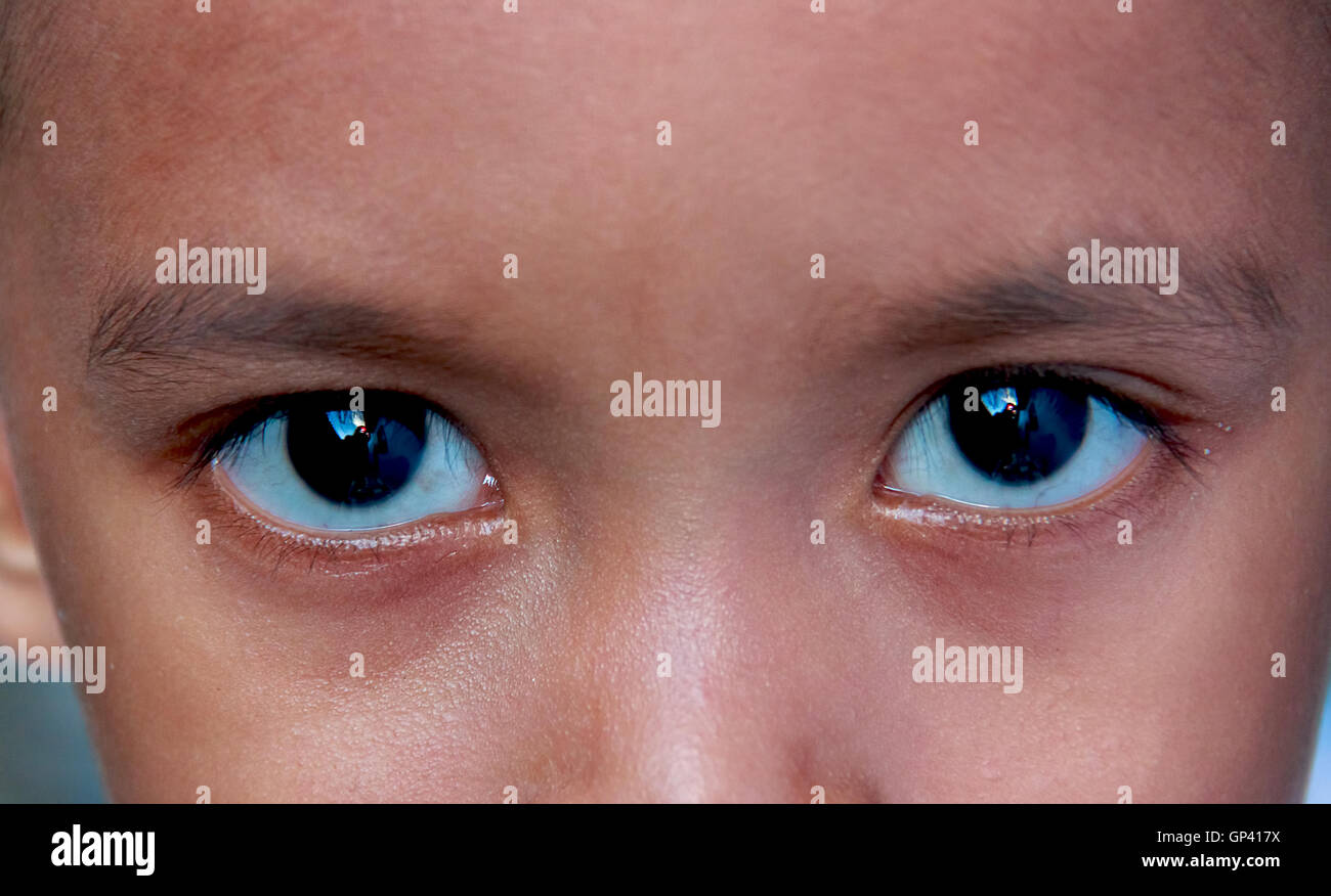 Asian boy standing focus on the eyes. Stock Photo