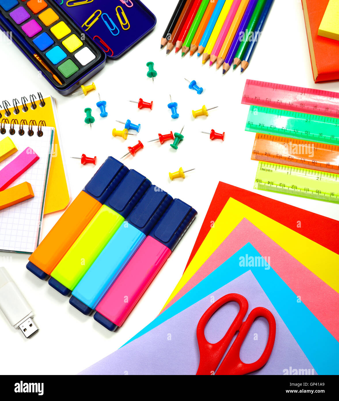 School supplies background, colorful paper, markers, pencils and other different stuff on the desk Stock Photo